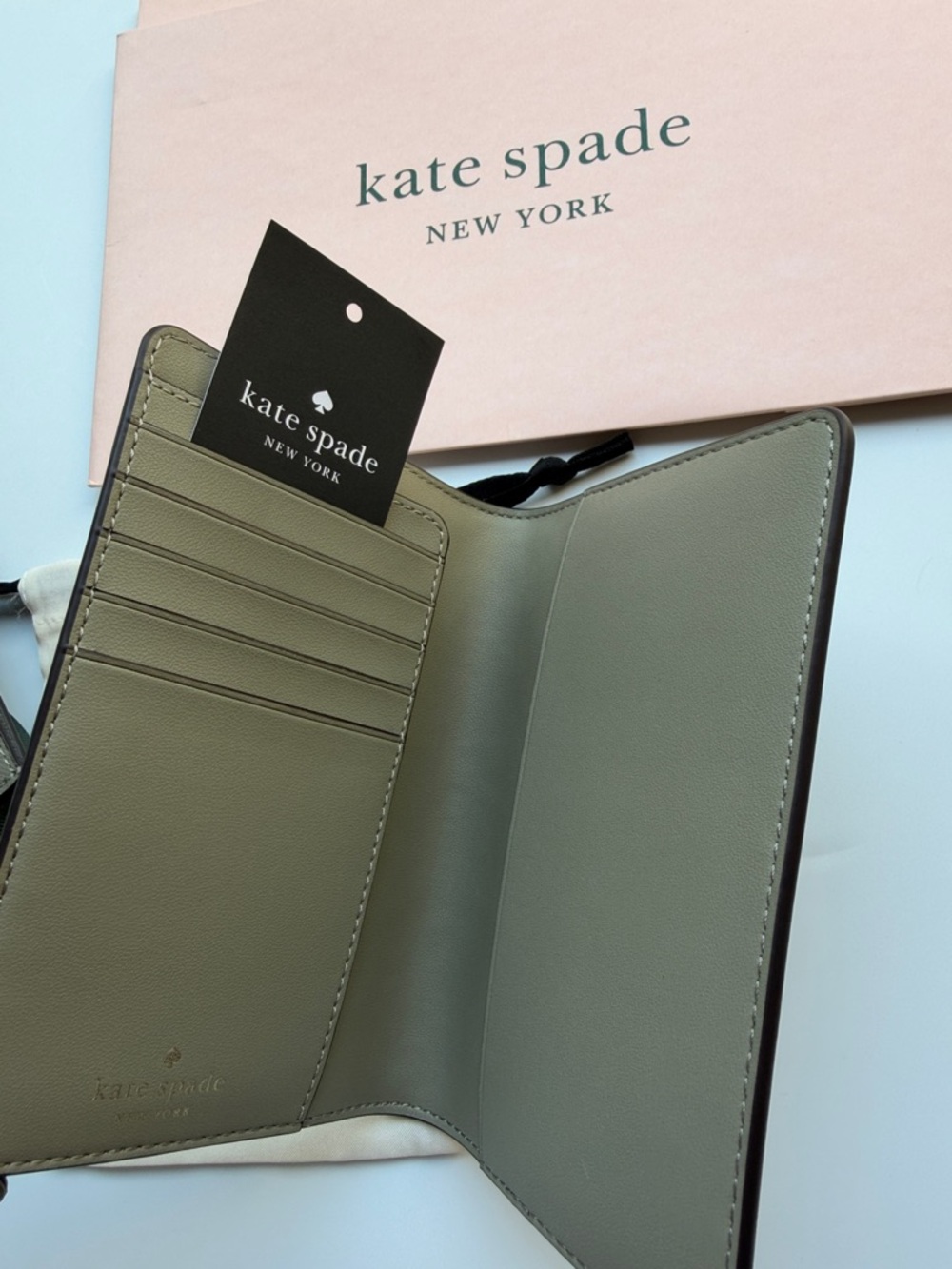 kate spade card holder & passport wallet with gold logo in oyster shell color - Picture 11 of 14